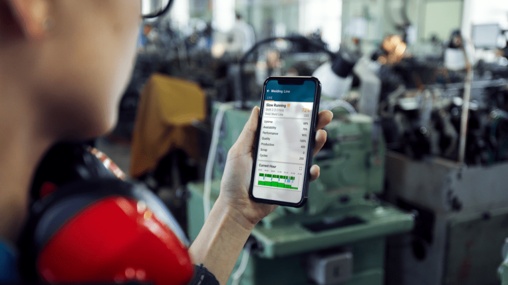 worker looking at the Shoplogix dashboard on his mobile device